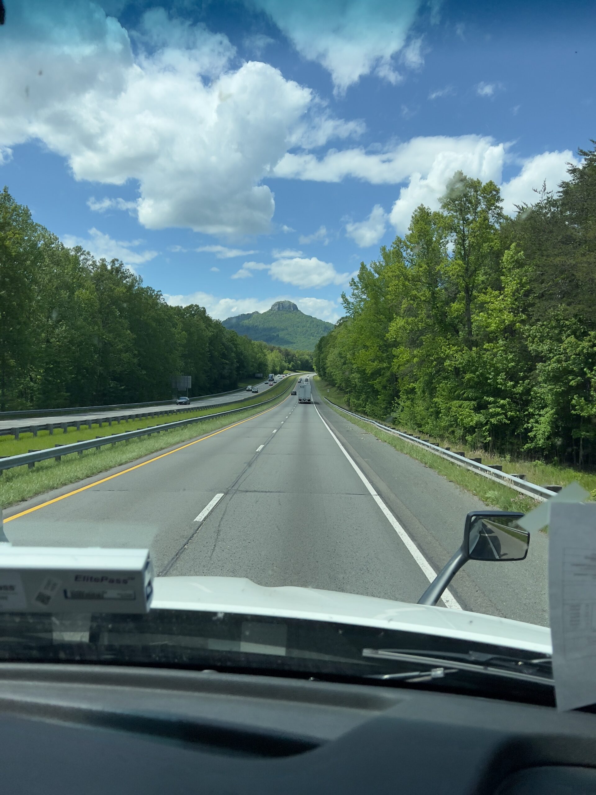 Pilot Mountain rising from the highway in North Carolina, view from the cab
